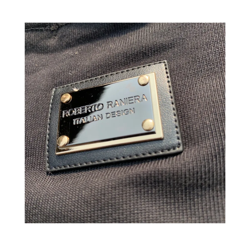 Italian Crest Sweatshirt Black Sweatshirt - Roberto Raniera - Close up of the Metallic and leather patch